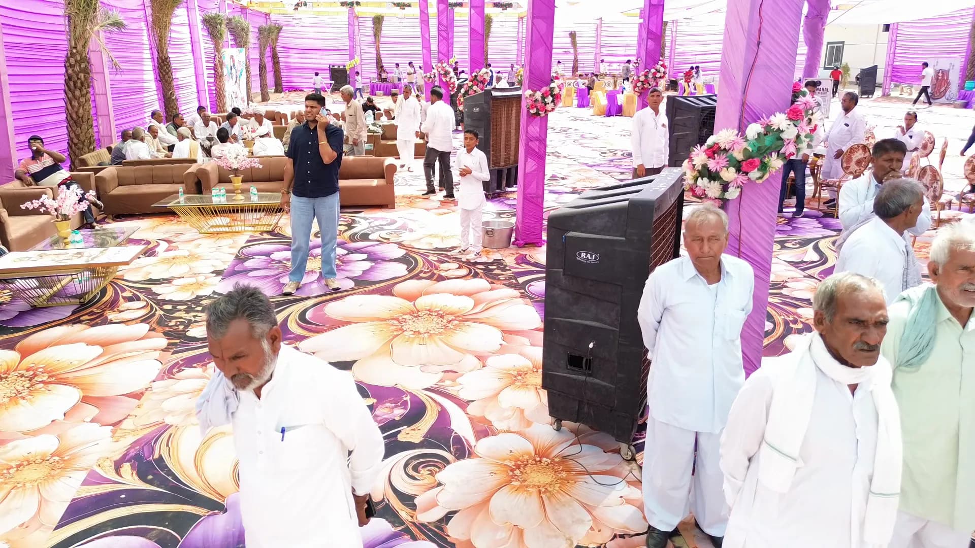 Guests gathered under the decorated pandal at Jay Mahal marriage garden