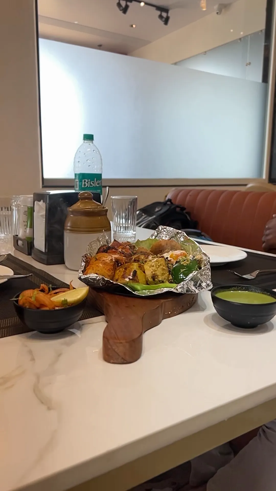Dining table set with freshly served food at Jay Mahal restaurant