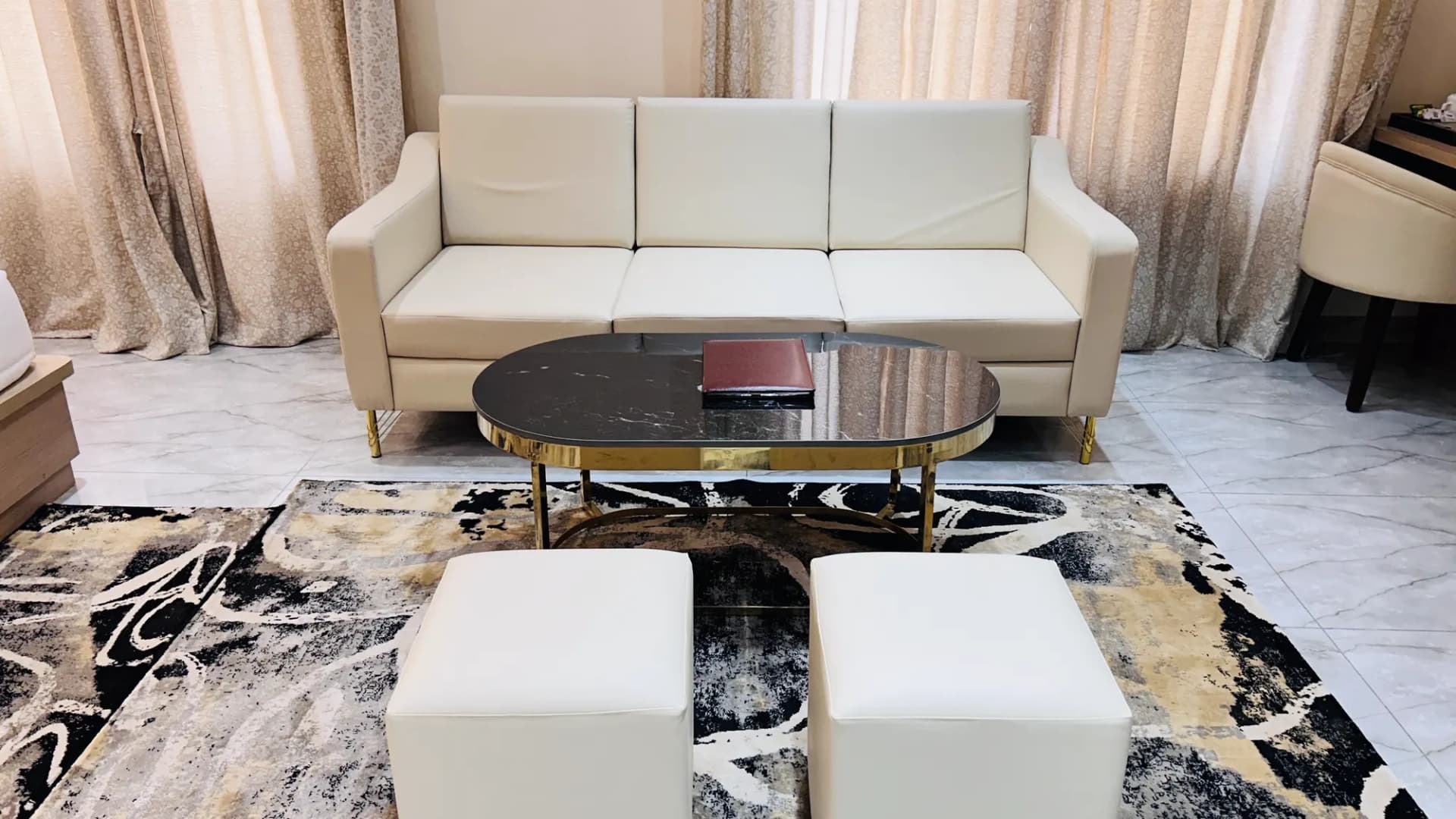 Sitting area with sofa in a premium room at Jay Mahal